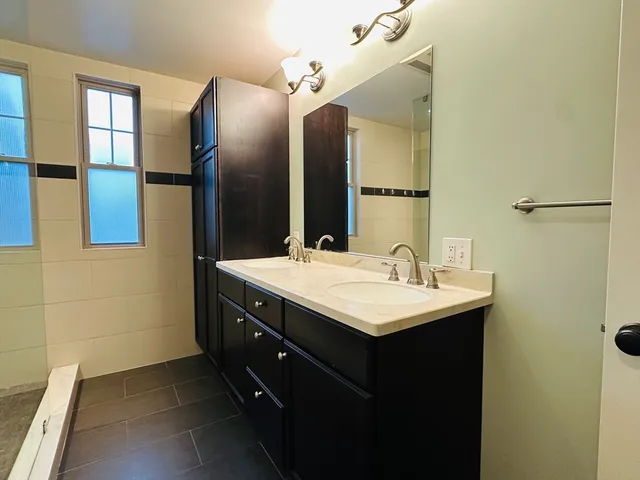 a bathroom with a sink and a mirror