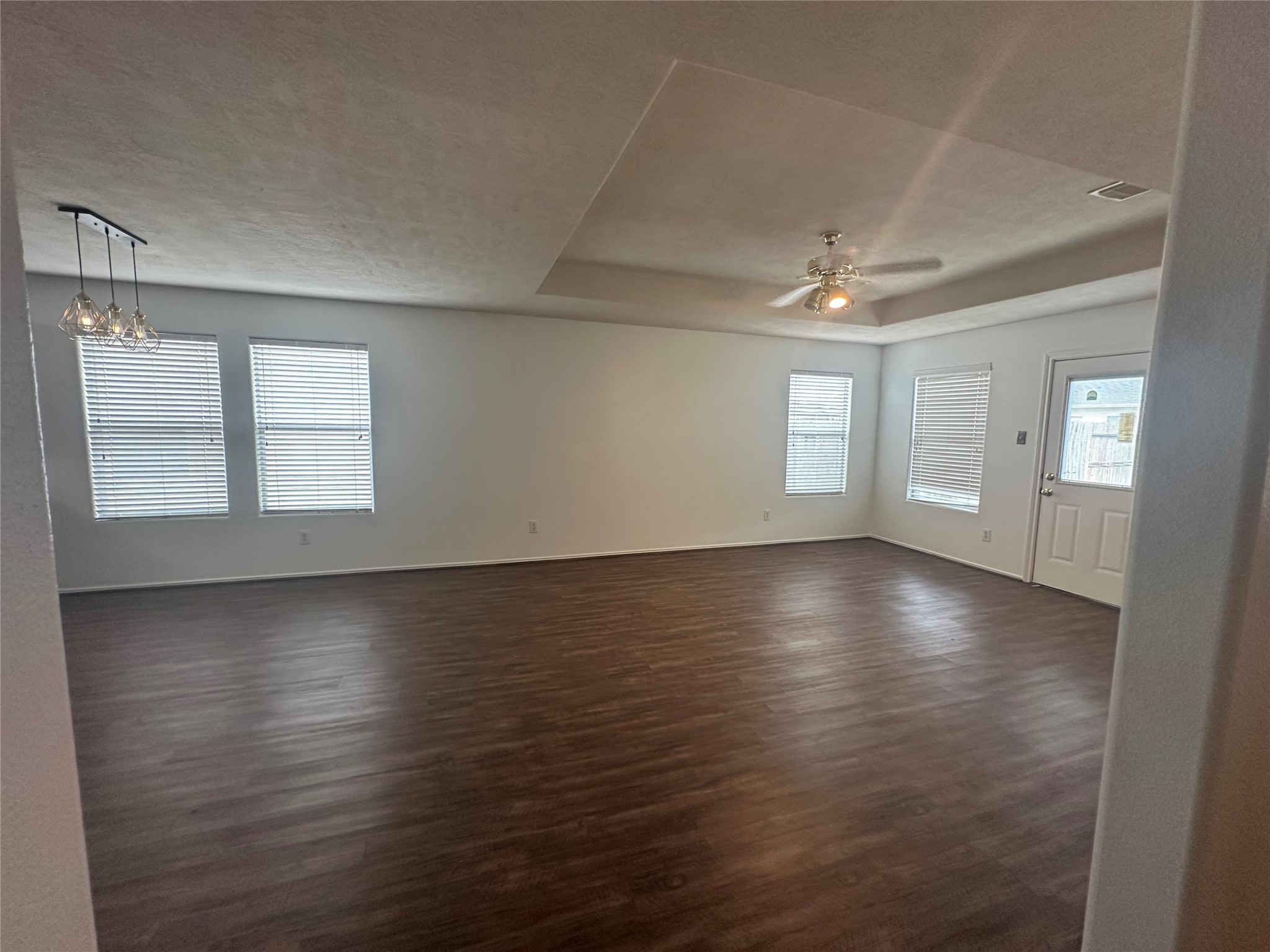 10331 Ravenwood View Lane Houston, TX 77075 - Photo 11 of 11 an empty room with wooden floor and windows