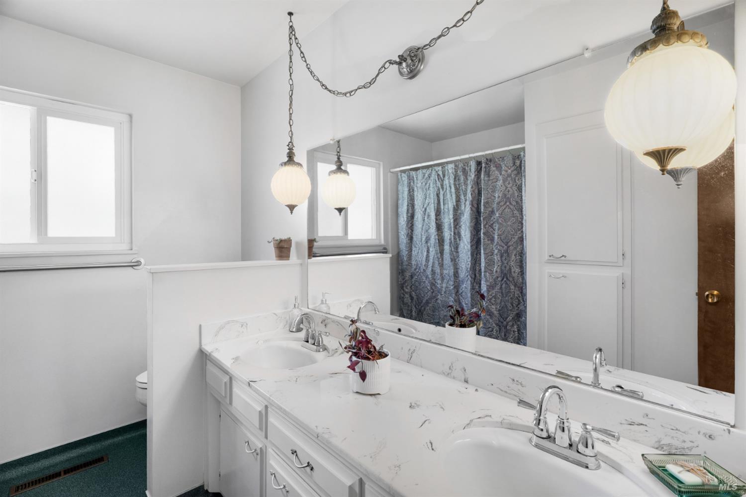 2904 Jason Drive Santa Rosa, CA 95405 - Photo 19 of 33 a bathroom with a sink and a mirror