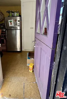 a stove top oven sitting inside of a kitchen