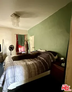 a hallway with wooden floor and furniture