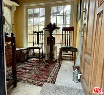 a view of an entryway with wooden floor and windows