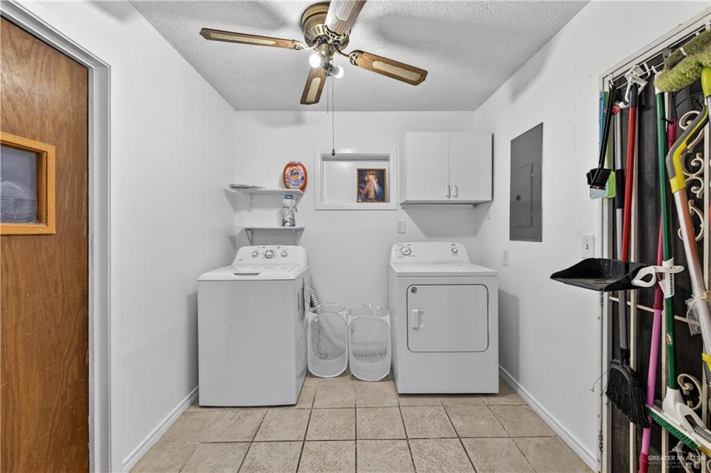 616 5th Street Weslaco, TX 78596 - Photo 24 of 33 a utility room with dryer and washer