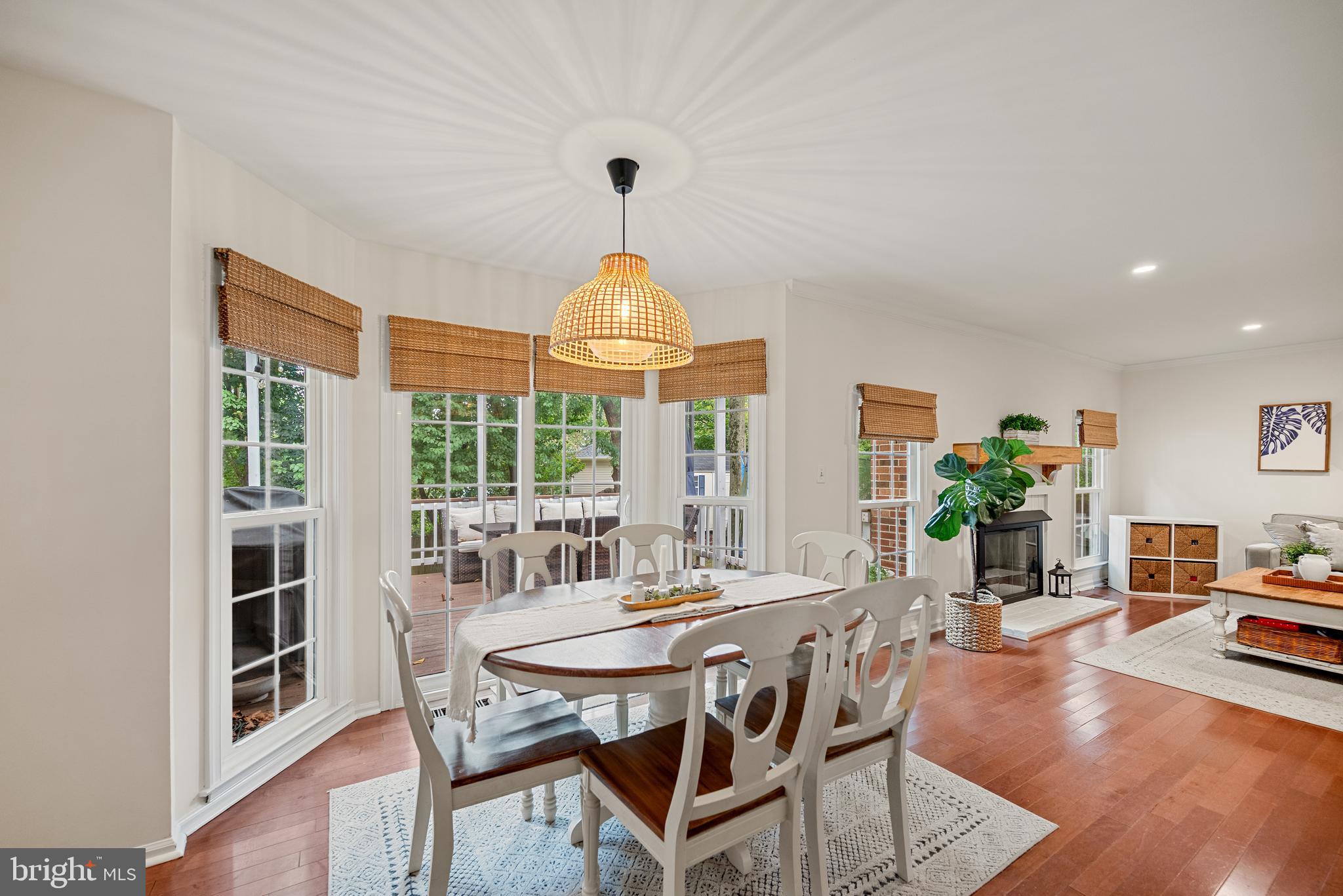 7838 Roundabout Way Springfield, VA 22153 - Photo 11 of 56 a dining room with furniture a chandelier and wooden floor