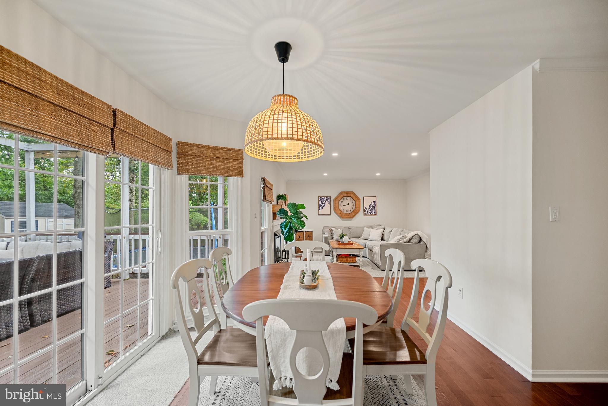 7838 Roundabout Way Springfield, VA 22153 - Photo 12 of 56 a view of a dining room with furniture wooden floor and chandelier