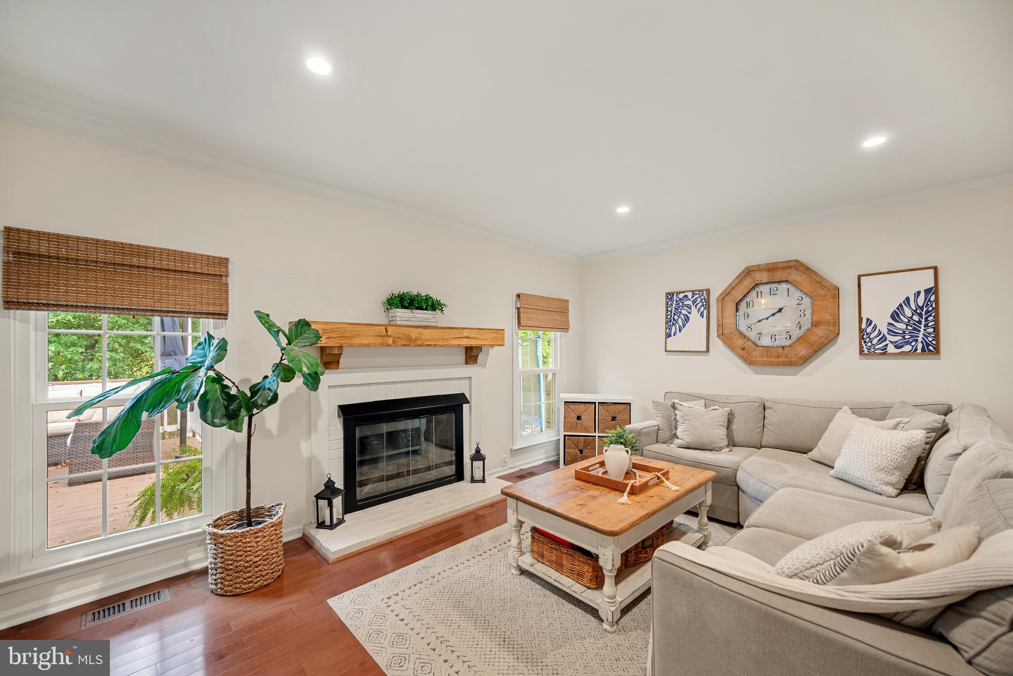 7838 Roundabout Way Springfield, VA 22153 - Photo 13 of 56 a living room with furniture a window and a fireplace