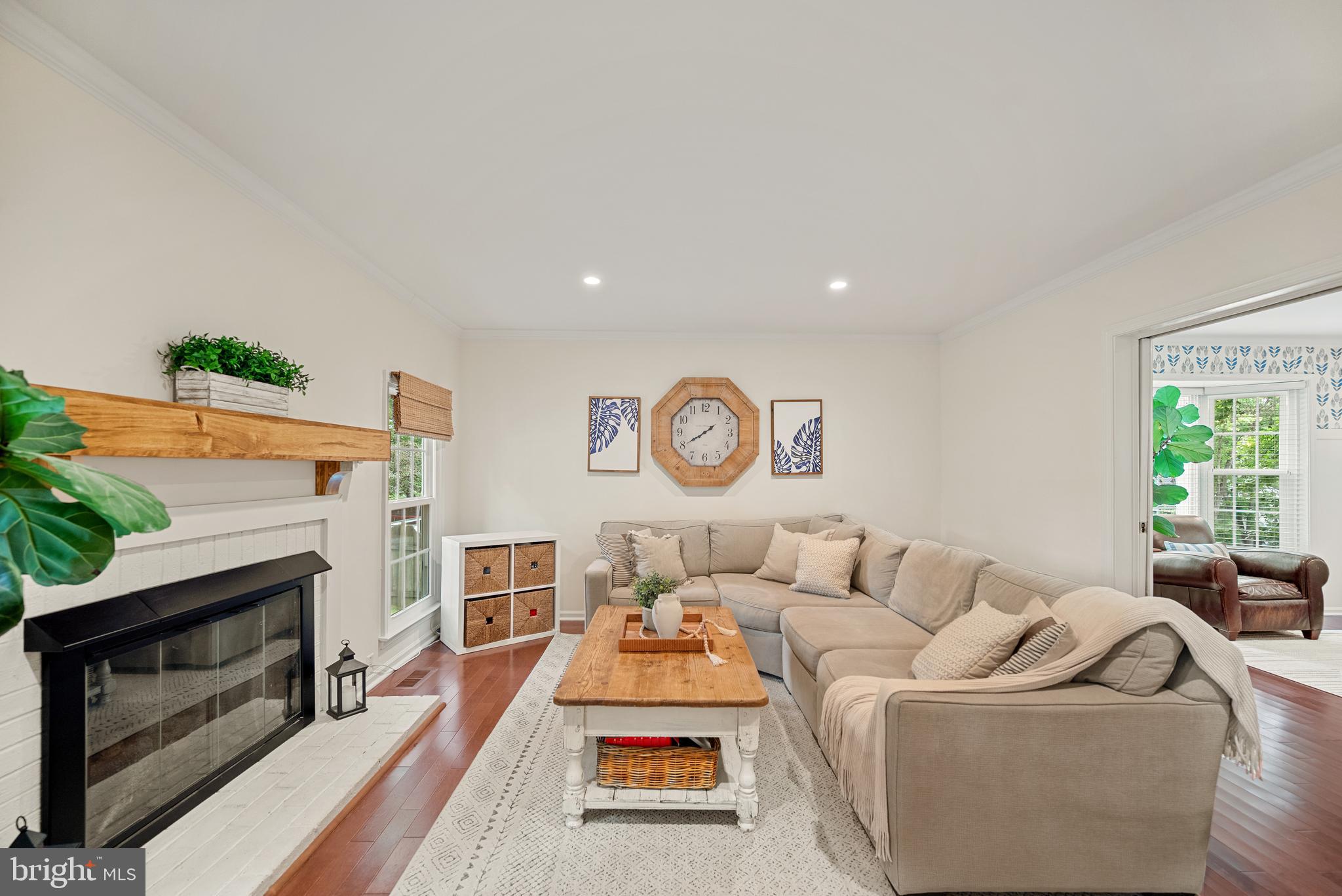 7838 Roundabout Way Springfield, VA 22153 - Photo 14 of 56 a living room with furniture and a fireplace