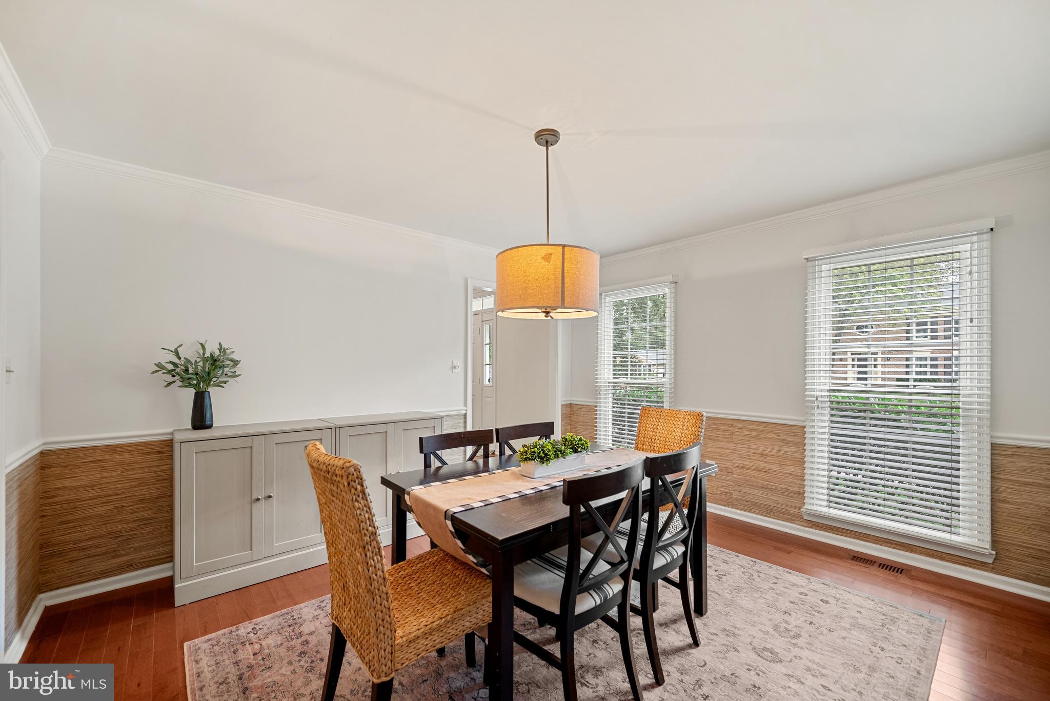 7838 Roundabout Way Springfield, VA 22153 - Photo 16 of 56 a view of a dining room with furniture window and wooden floor