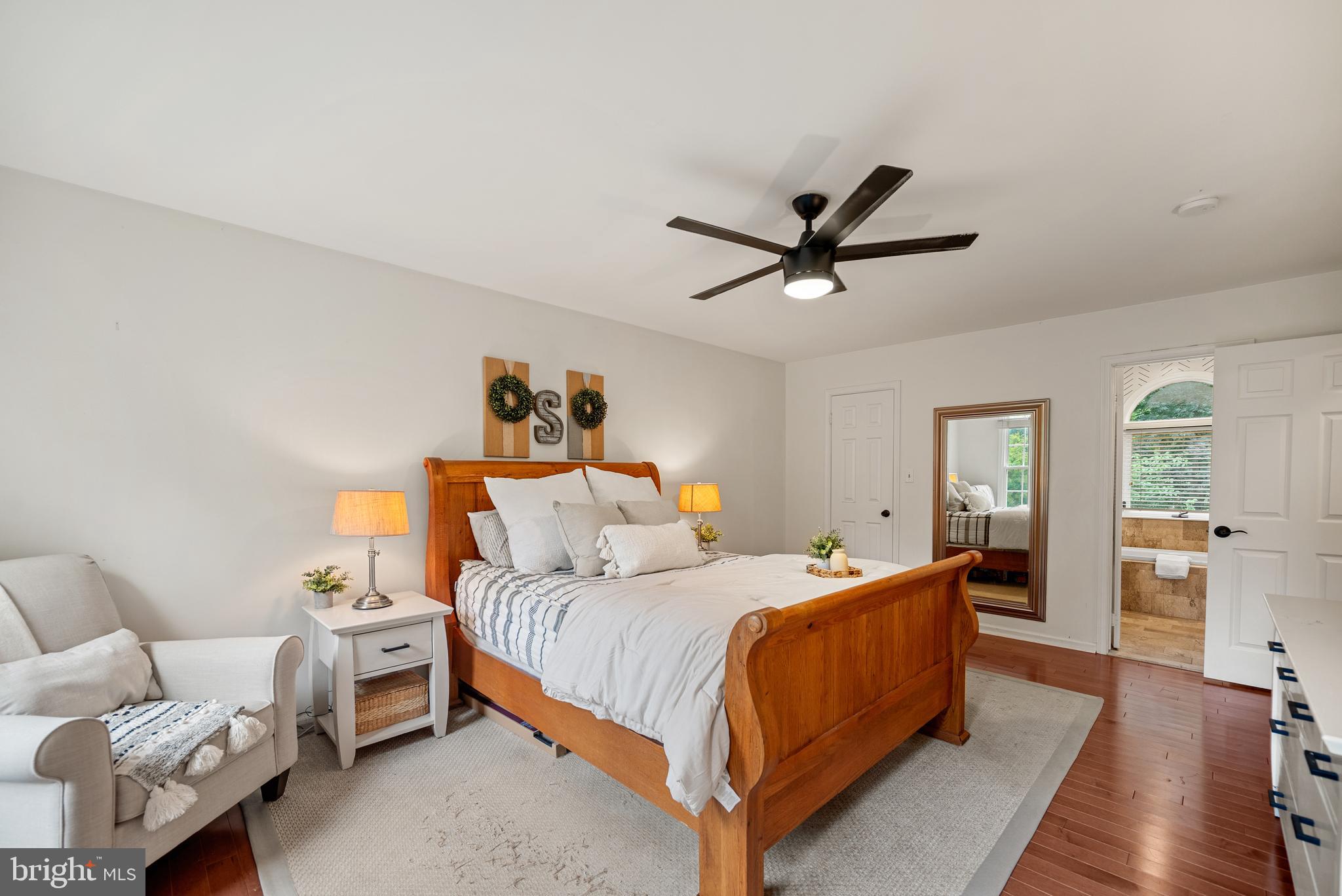 7838 Roundabout Way Springfield, VA 22153 - Photo 22 of 56 a bedroom with a bed and wooden floor