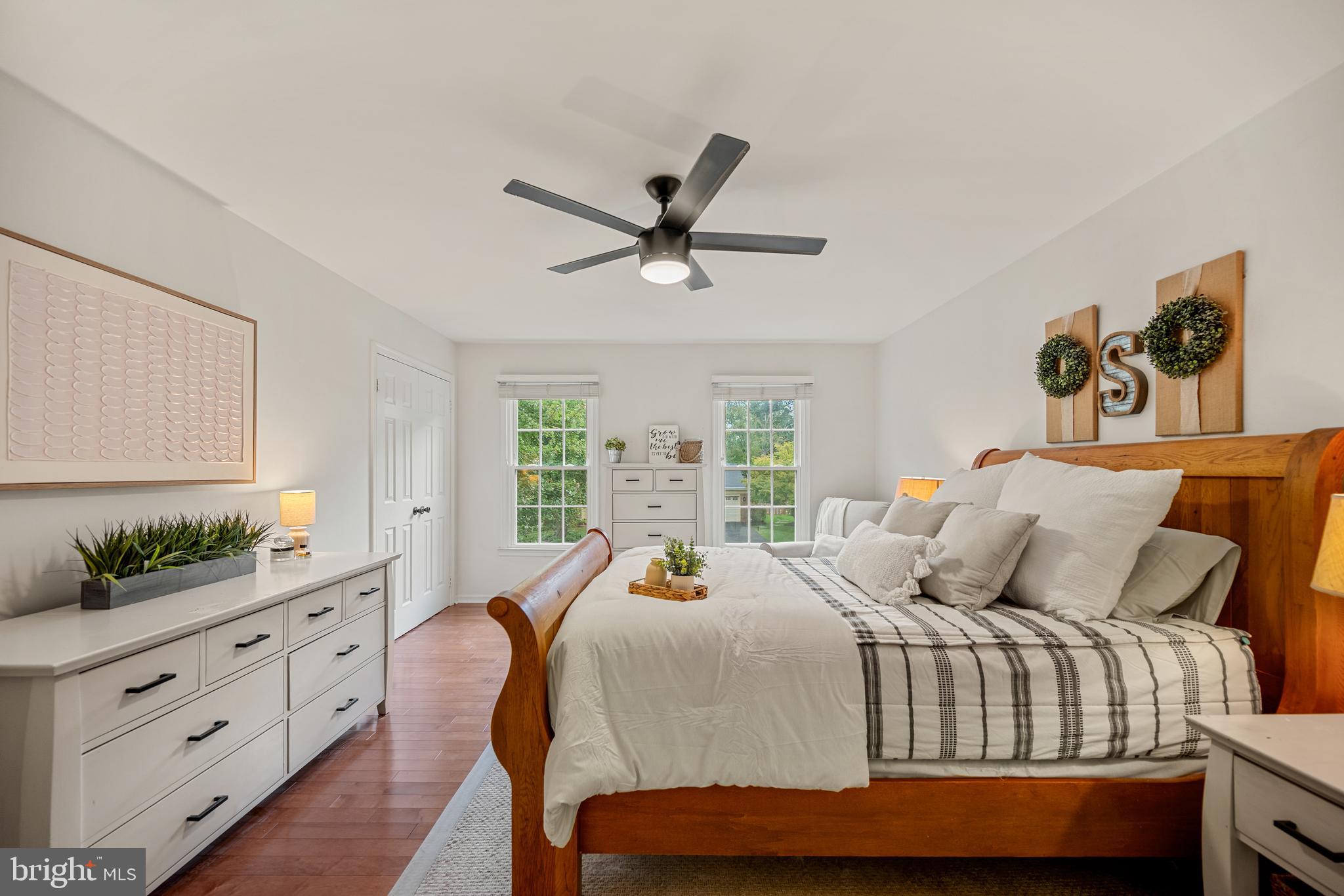 7838 Roundabout Way Springfield, VA 22153 - Photo 24 of 56 a bedroom with a bed and wooden floor