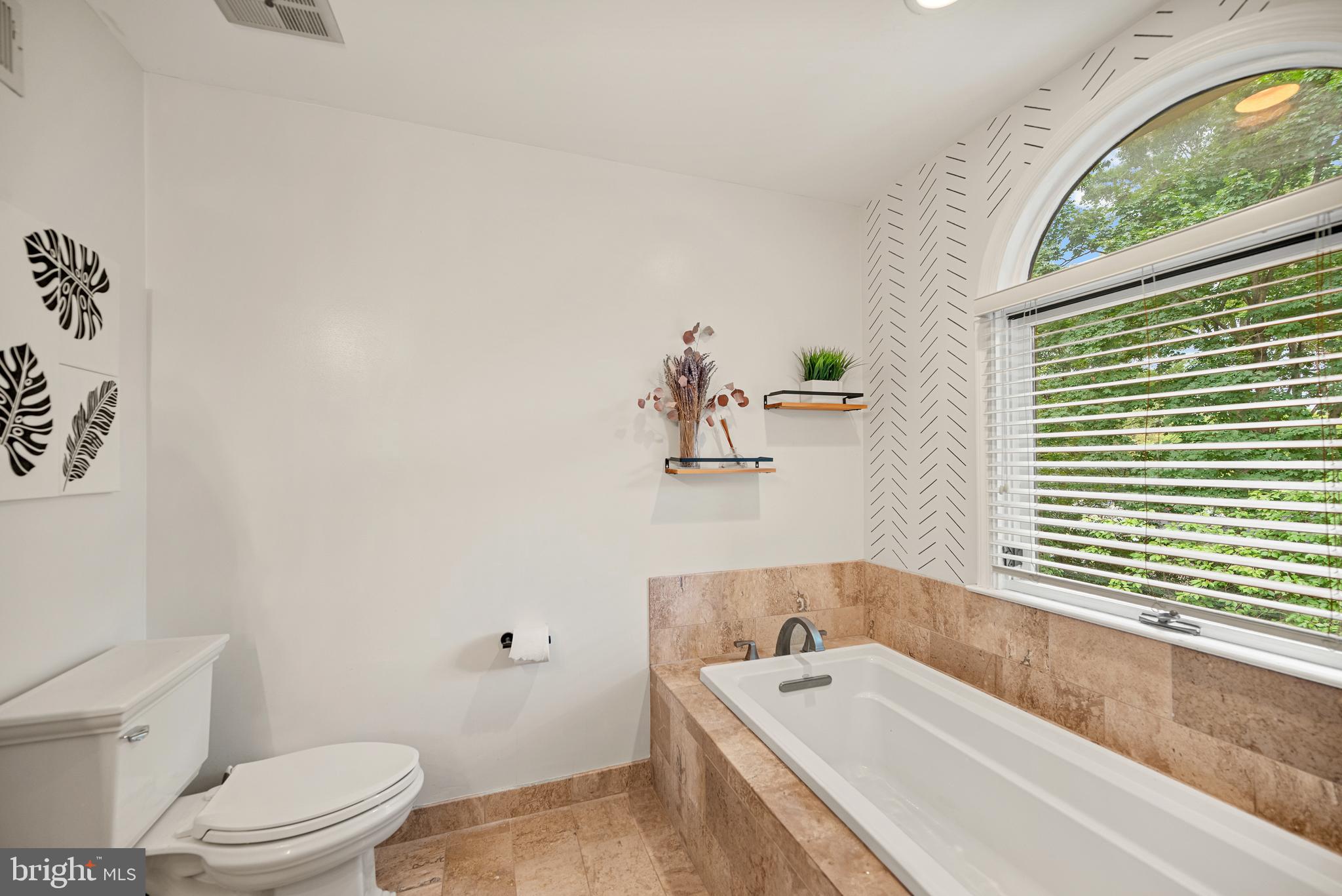 7838 Roundabout Way Springfield, VA 22153 - Photo 26 of 56 a bathroom with a bathtub and sink