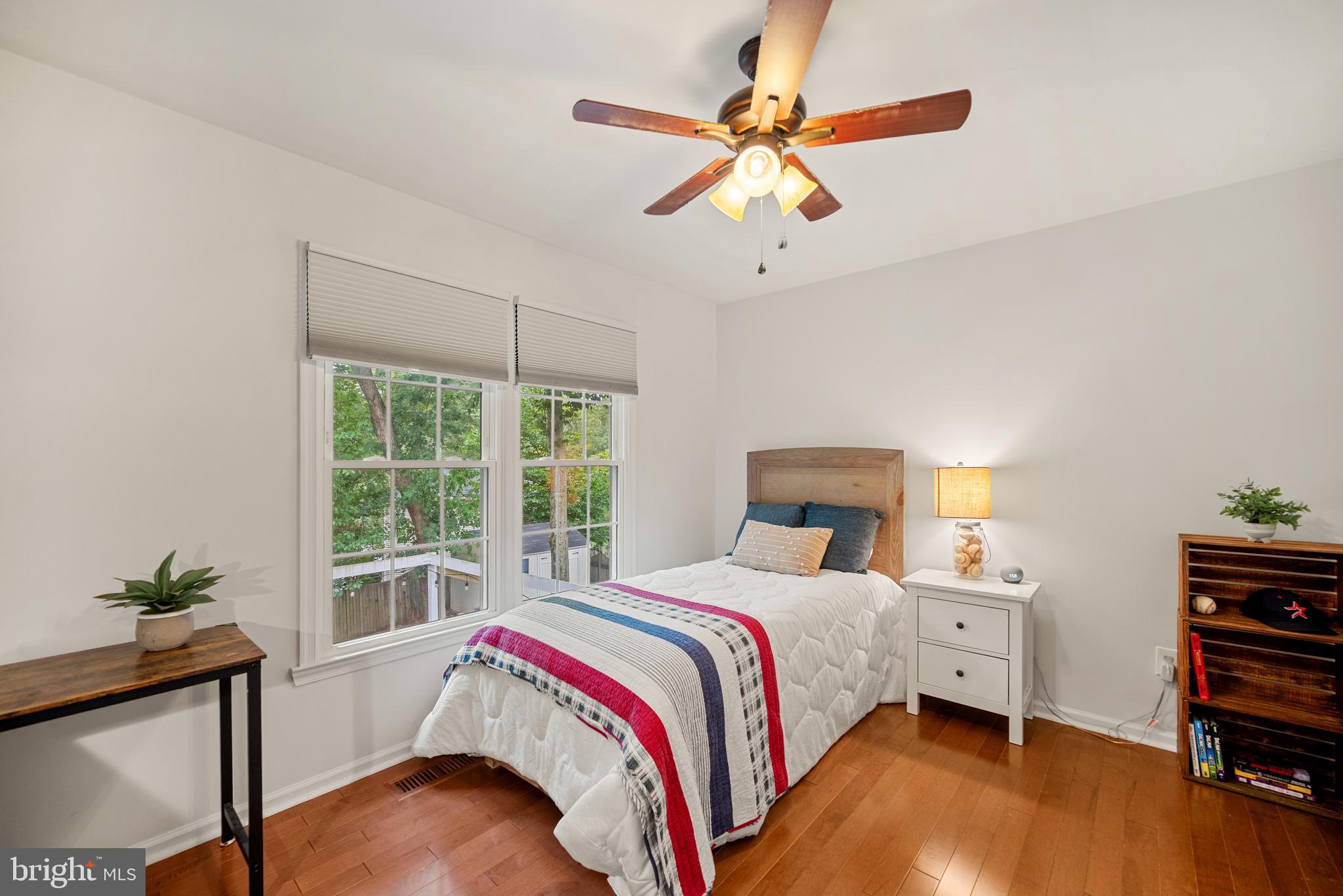 7838 Roundabout Way Springfield, VA 22153 - Photo 27 of 56 a bedroom with a bed and a chandelier