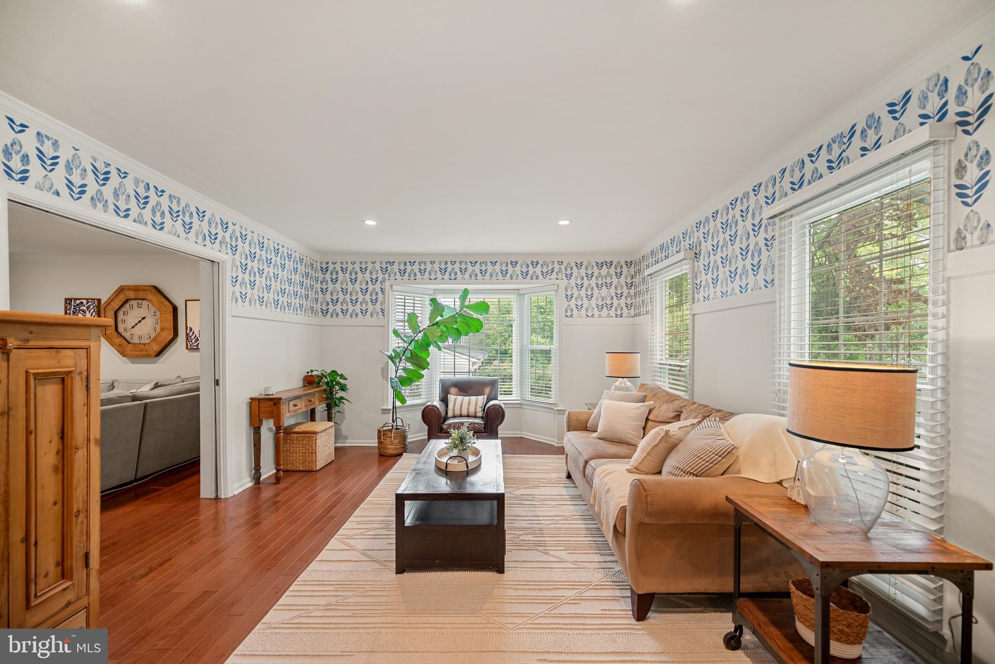 7838 Roundabout Way Springfield, VA 22153 - Photo 3 of 56 a living room with fireplace furniture and a wooden floor
