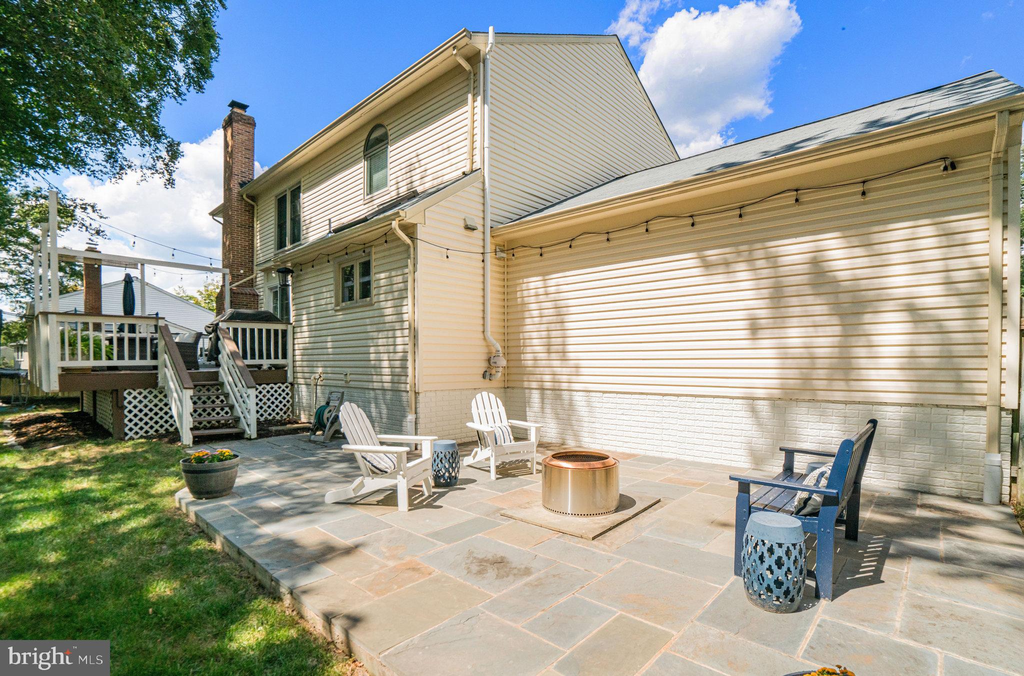 7838 Roundabout Way Springfield, VA 22153 - Photo 43 of 56 a view of backyard with a patio and outdoor seating