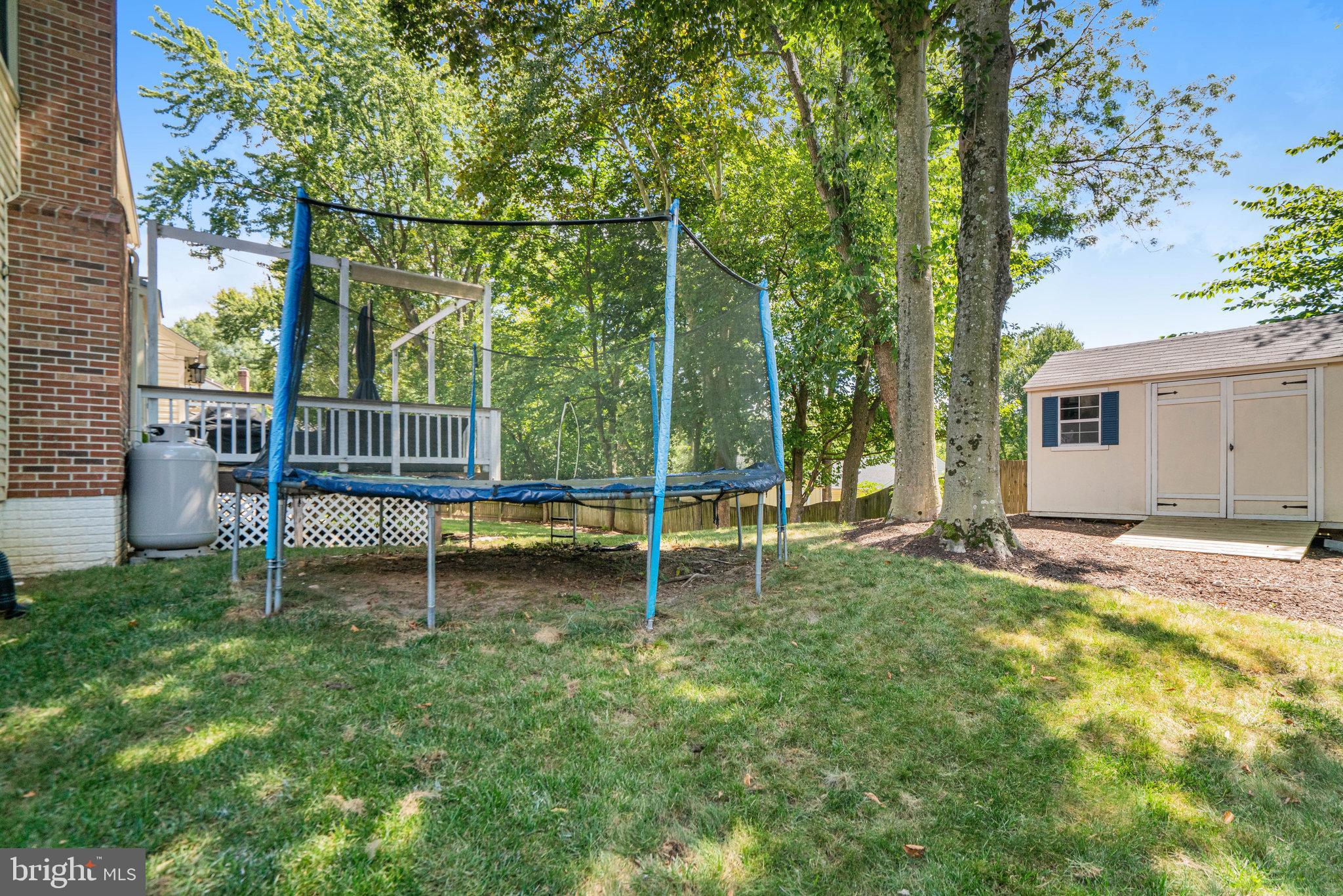 7838 Roundabout Way Springfield, VA 22153 - Photo 47 of 56 a view of a house with a backyard and a tree