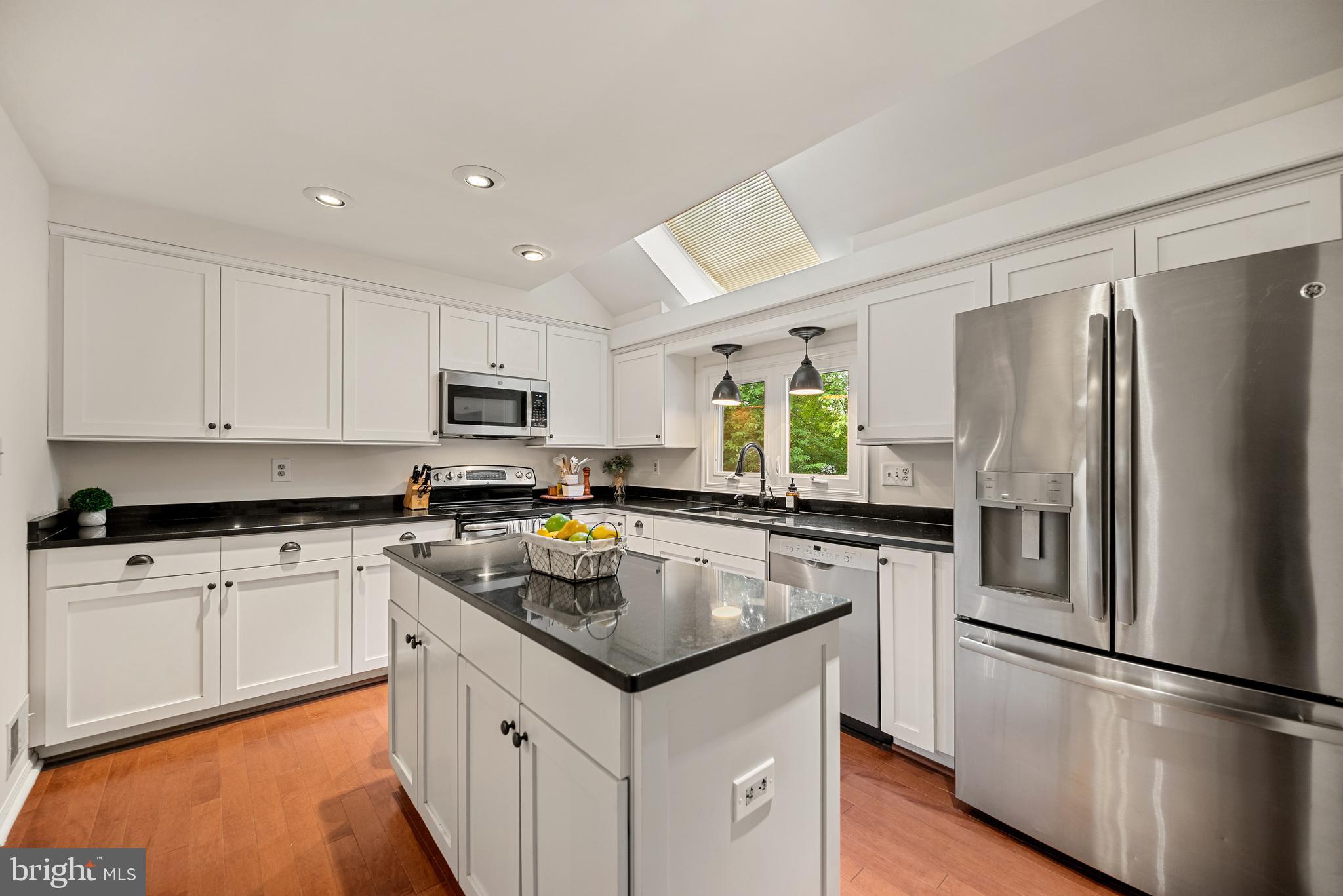7838 Roundabout Way Springfield, VA 22153 - Photo 7 of 56 a kitchen with a refrigerator sink and microwave