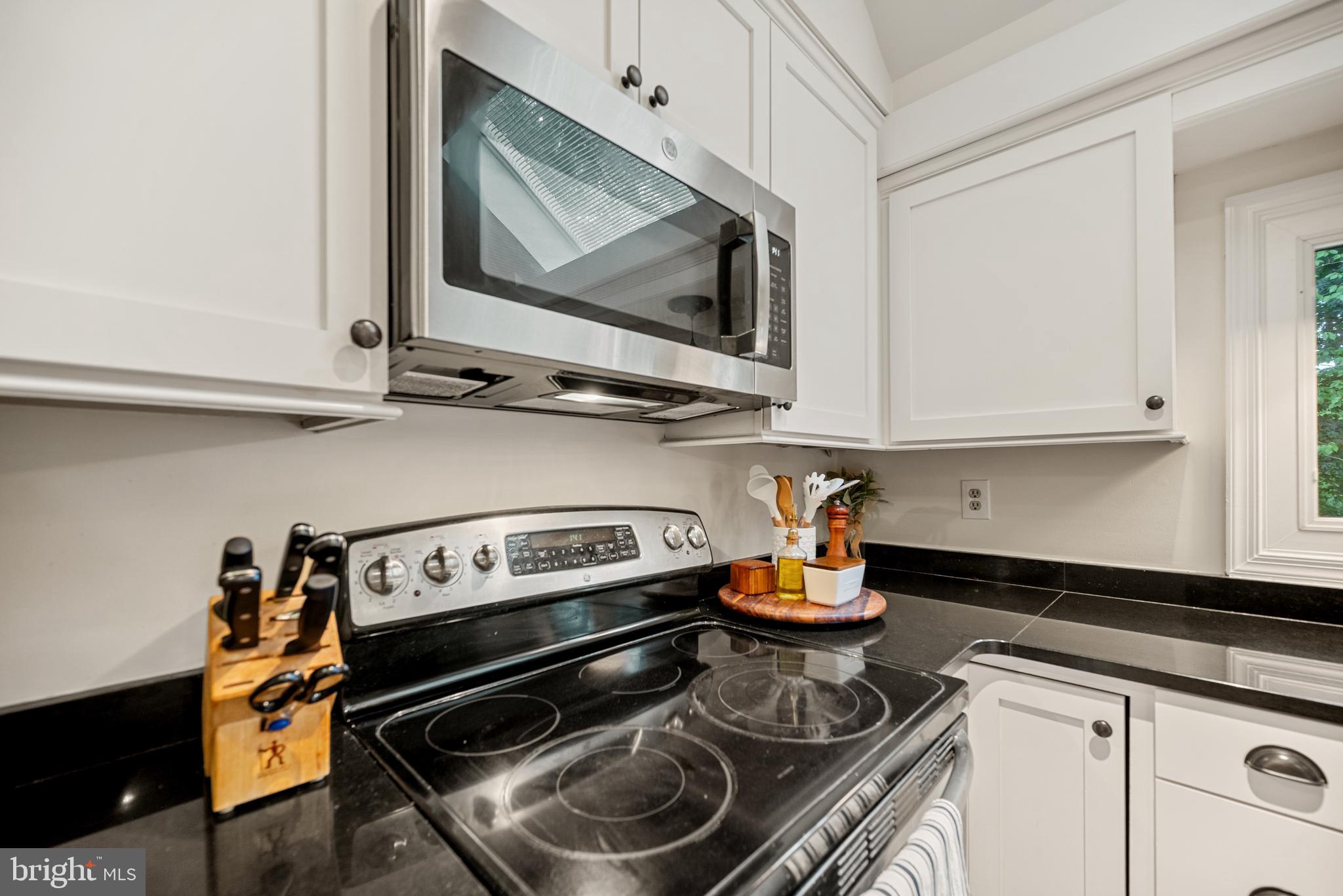 7838 Roundabout Way Springfield, VA 22153 - Photo 10 of 56 a kitchen with a stove and cabinets