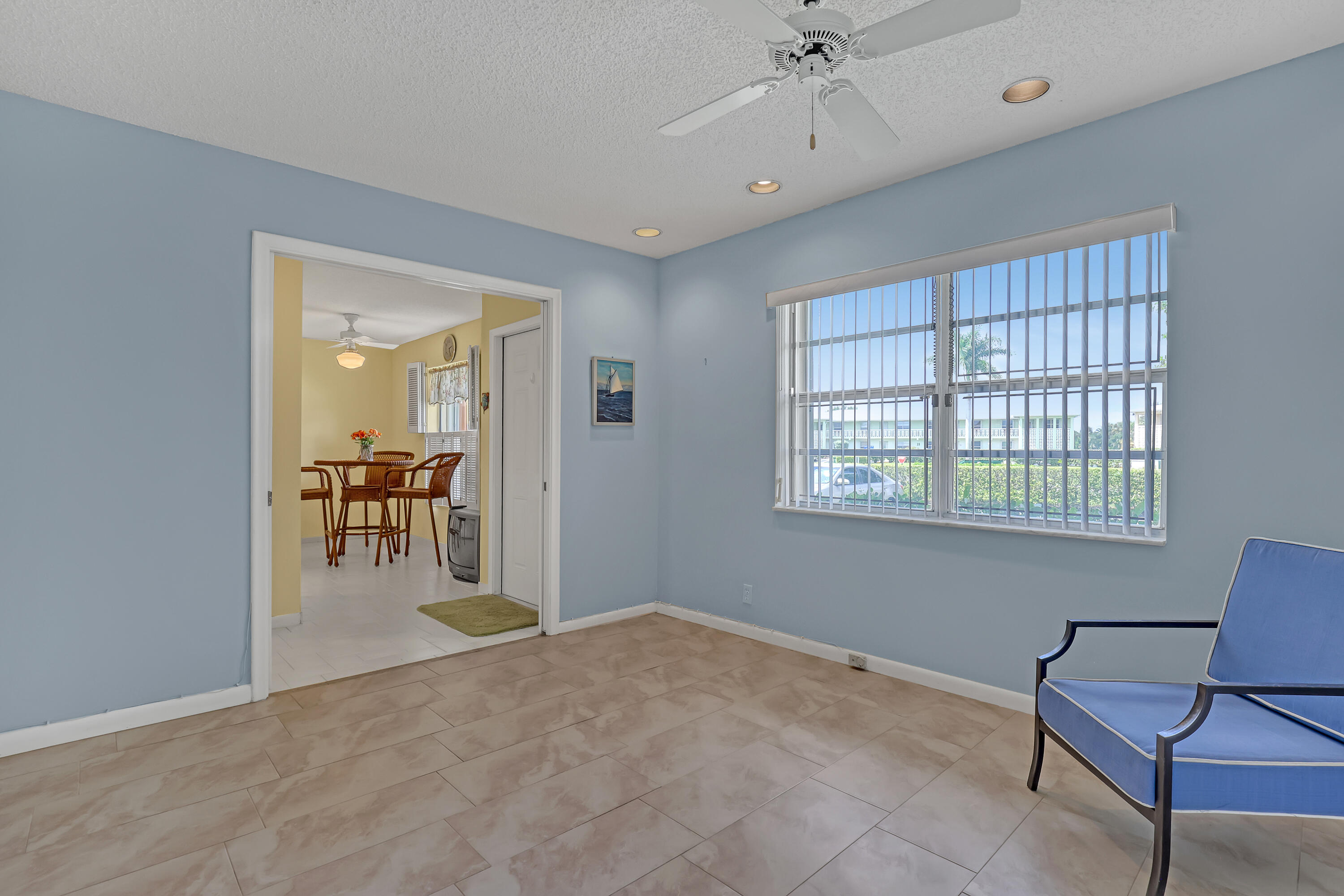 1850 Northwest 18th Street, Unit 103 Delray Beach, FL 33445 - Photo 21 of 28 a view of a livingroom with a lounge chair