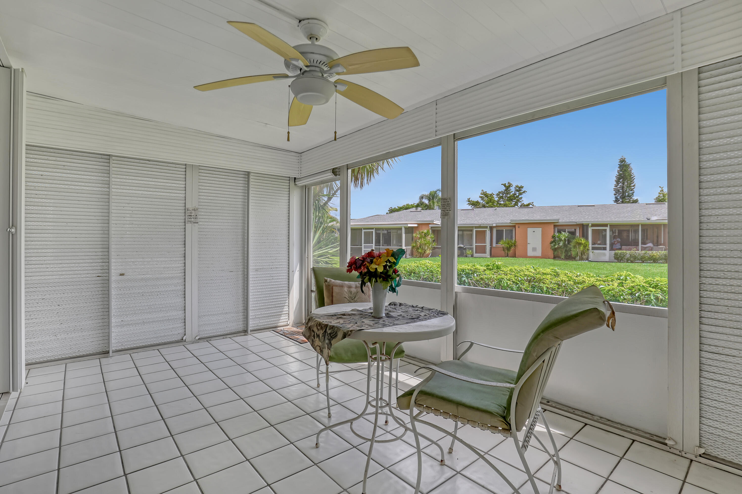 1850 Northwest 18th Street, Unit 103 Delray Beach, FL 33445 - Photo 23 of 28 a living room with furniture