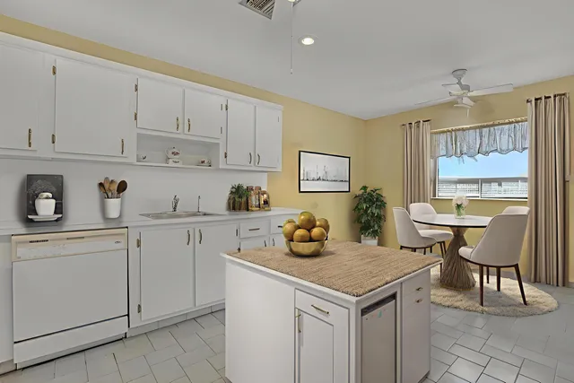a kitchen with a cabinets and chairs