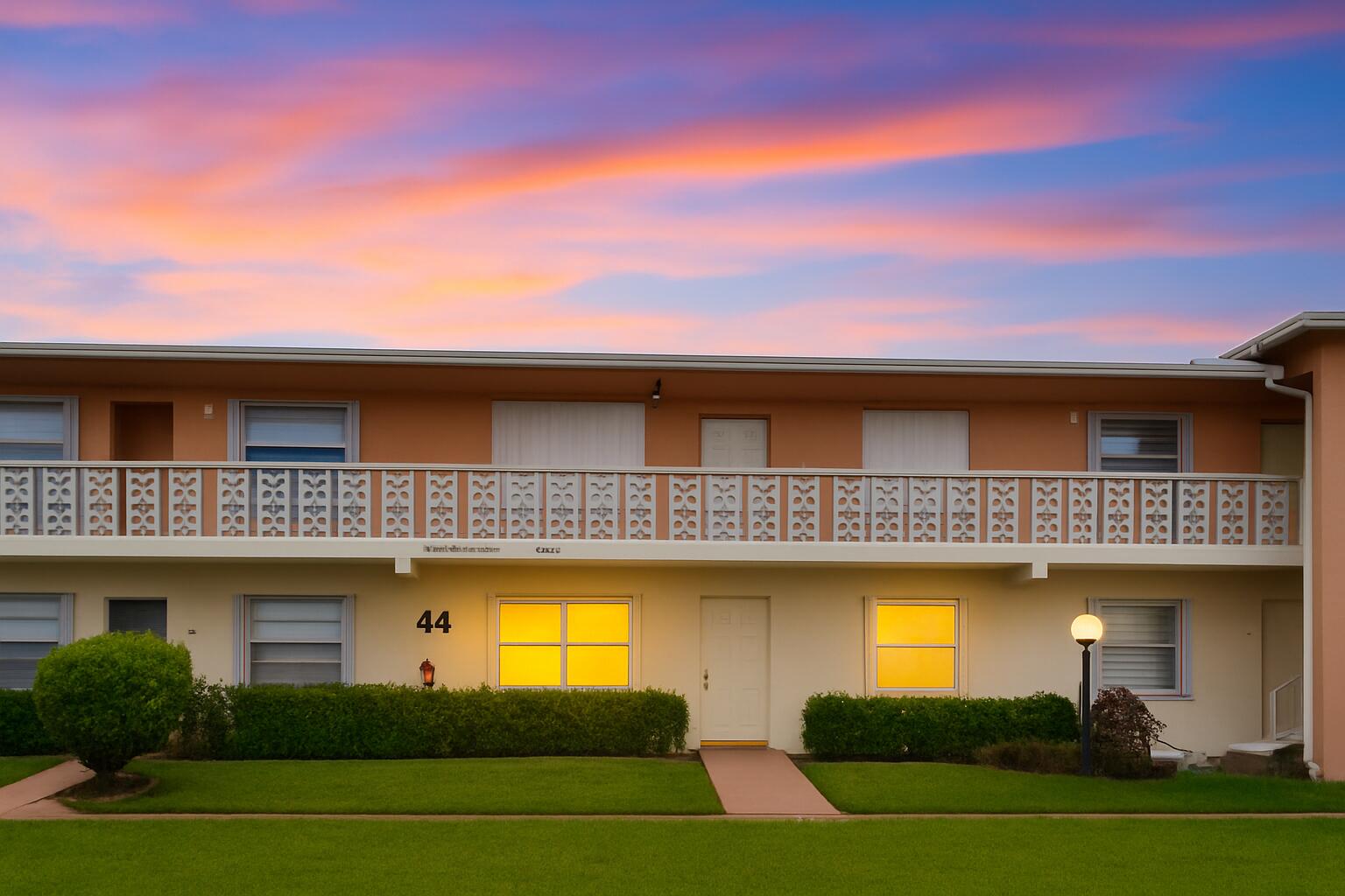 1850 Northwest 18th Street, Unit 103 Delray Beach, FL 33445 - Photo 4 of 28 a view of a house with a swimming pool