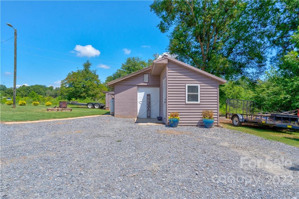 1220 Tot Dellinger Road Cherryville, NC 28021 - Photo 26 of 30 a view of a house with backyard and a garden