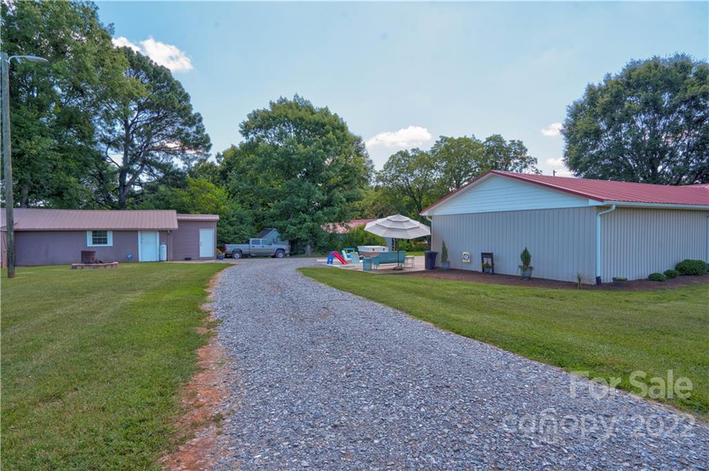1220 Tot Dellinger Road Cherryville, NC 28021 - Photo 28 of 30 a front view of a house with a yard and garage