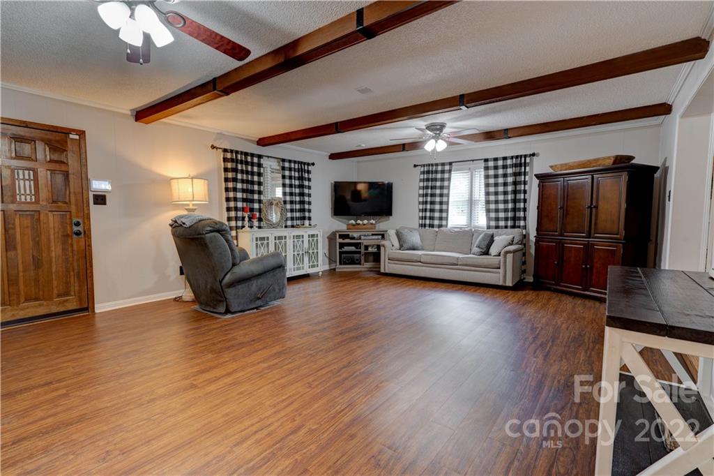 1220 Tot Dellinger Road Cherryville, NC 28021 - Photo 8 of 30 a living room with furniture and a flat screen tv
