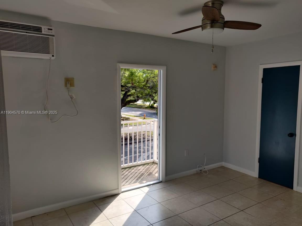 2300 Southwest 3rd Avenue, Unit 9 Miami, FL 33129 - Photo 6 of 13 a view of an empty room with a window