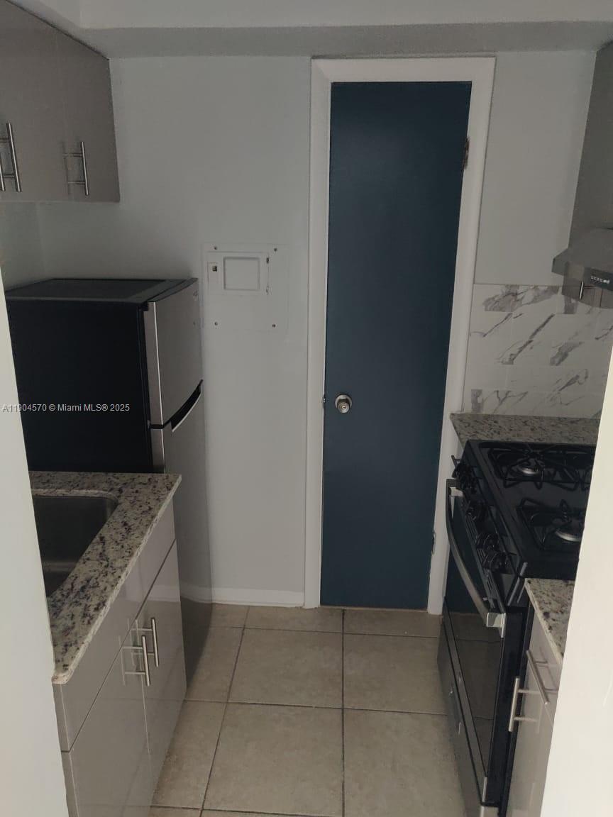 2300 Southwest 3rd Avenue, Unit 9 Miami, FL 33129 - Photo 7 of 13 a utility room with washer and dryer