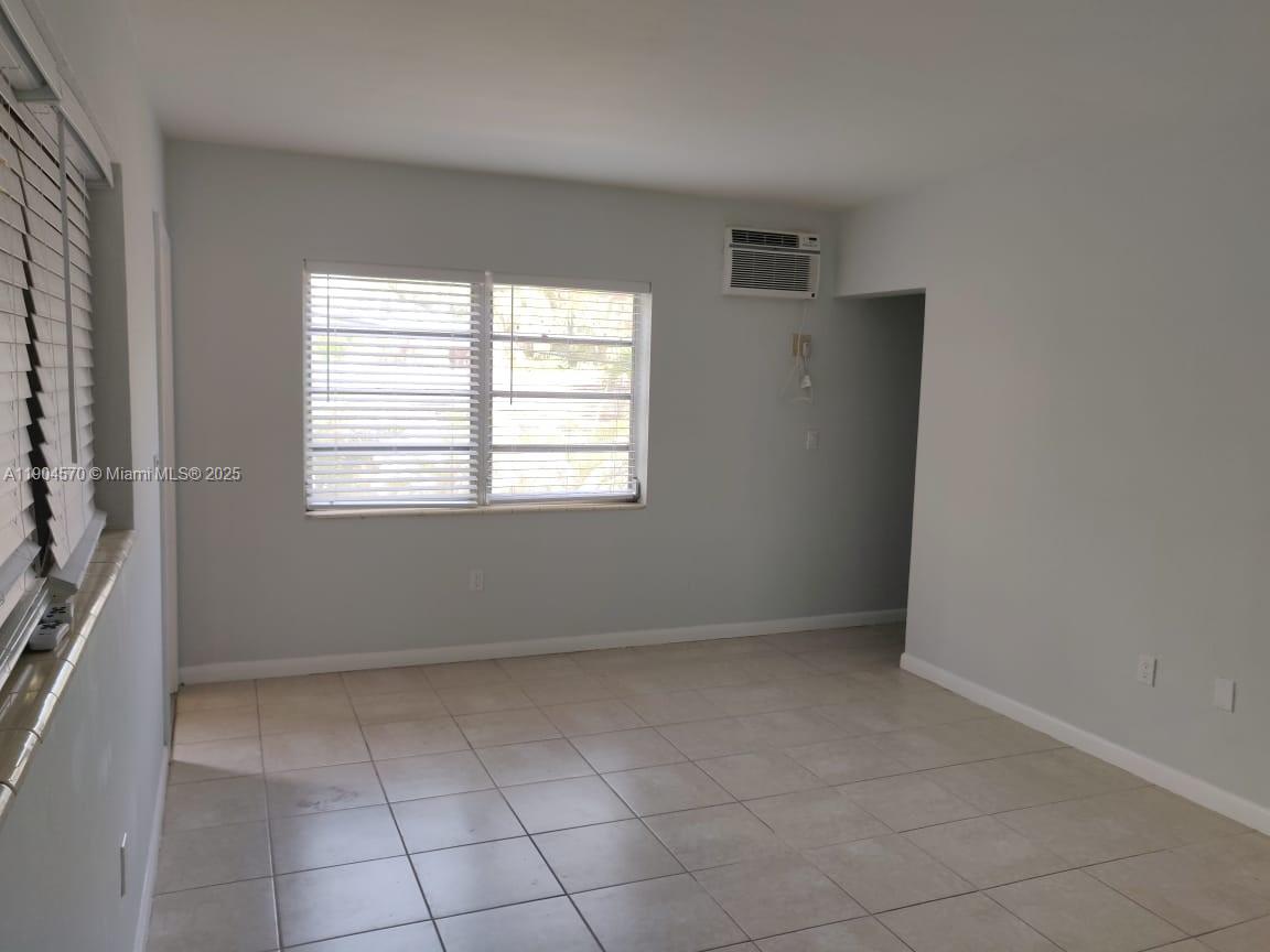 2300 Southwest 3rd Avenue, Unit 9 Miami, FL 33129 - Photo 9 of 13 a view of an empty room with a window