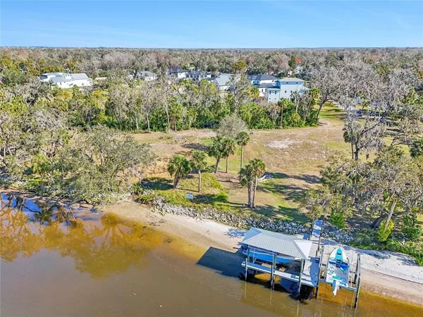 an aerial view of a house with a yard