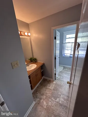 a view of a livingroom with furniture and staircase