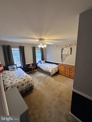 a bedroom with bed and window