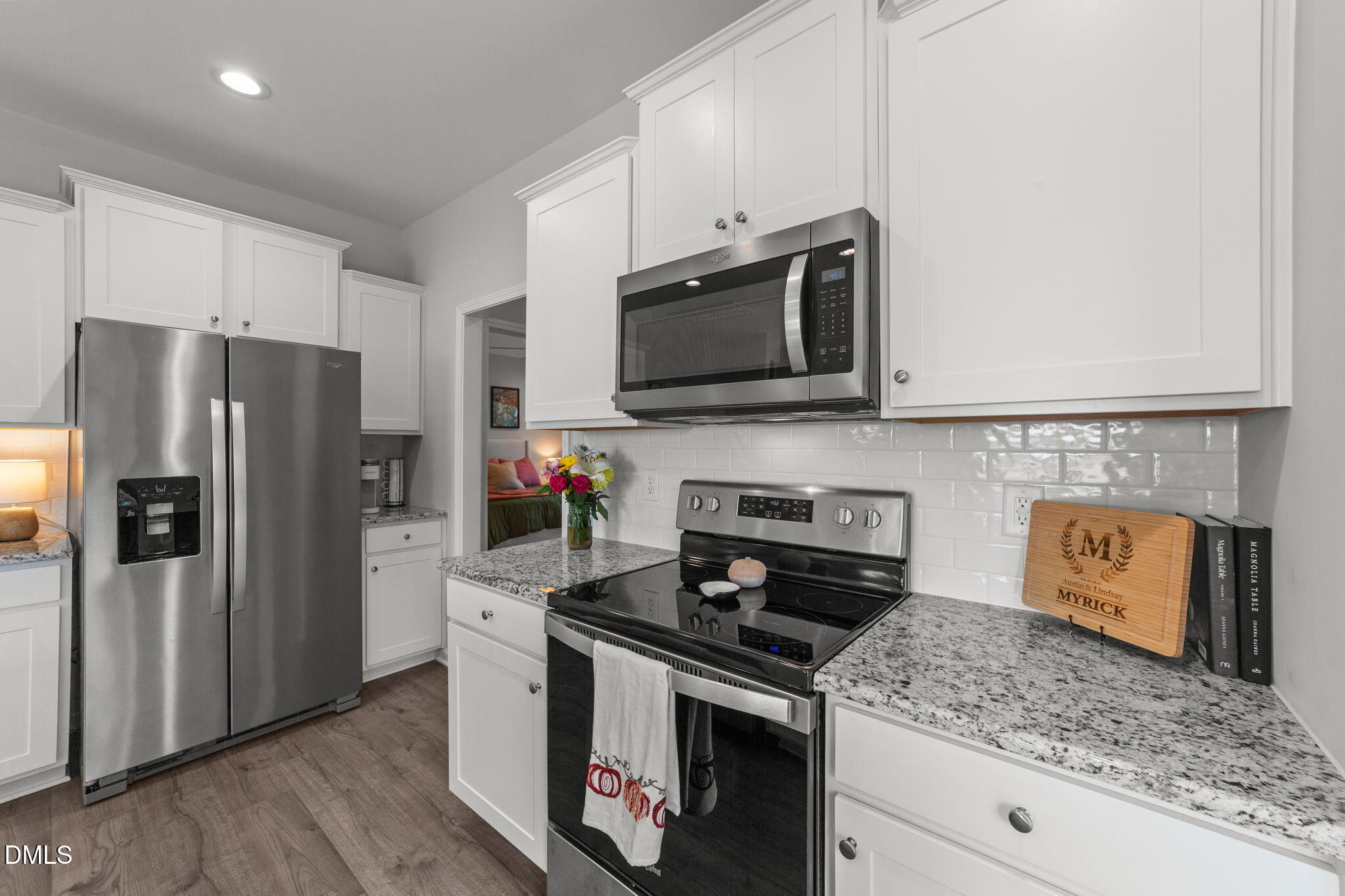 67 Overdrift Court Selma, NC 27576 - Photo 15 of 36 a kitchen with stainless steel appliances granite countertop a stove microwave refrigerator and sink