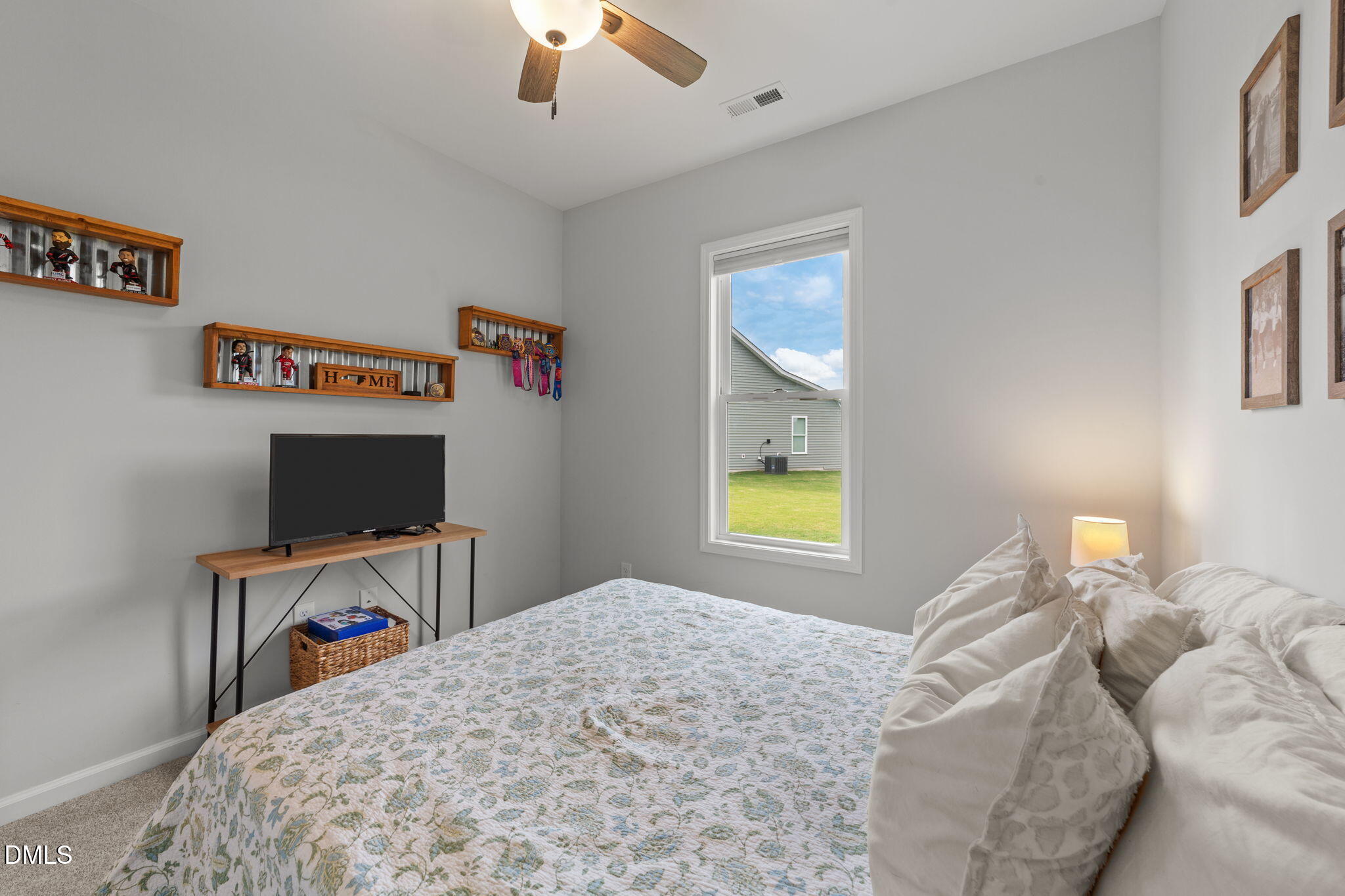 67 Overdrift Court Selma, NC 27576 - Photo 20 of 36 a bedroom with a bed and a desk