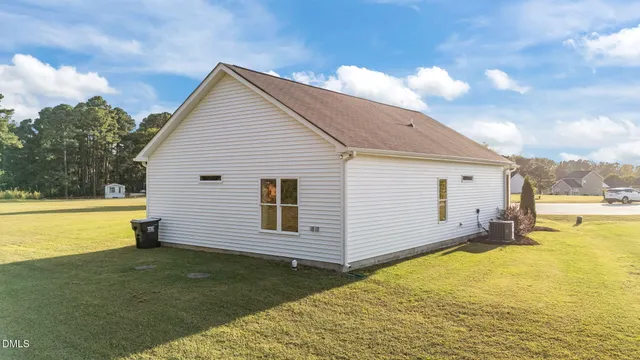 a view of a backyard with swimming pool