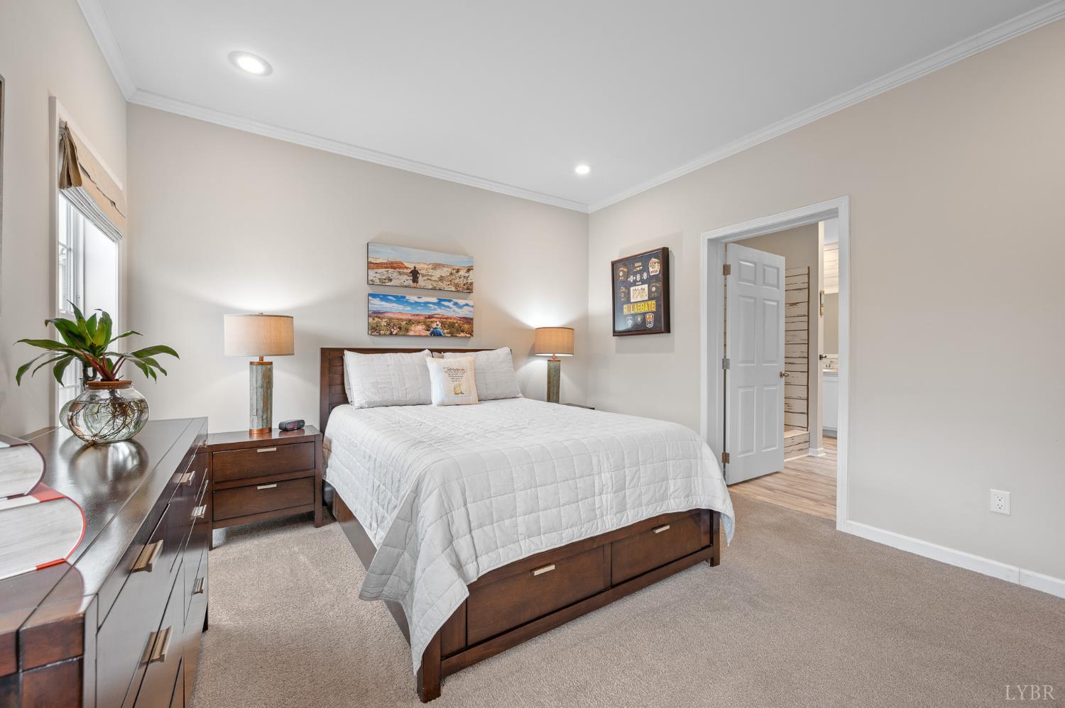 5049 Horseshoe Bend Road Goodview, VA 24095 - Photo 19 of 43 a bedroom with a bed and a potted plant