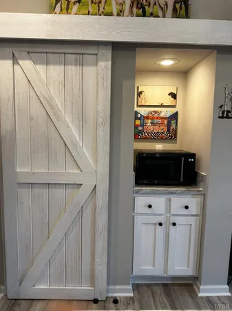 a backyard of a house with barbeque oven and outdoor seating