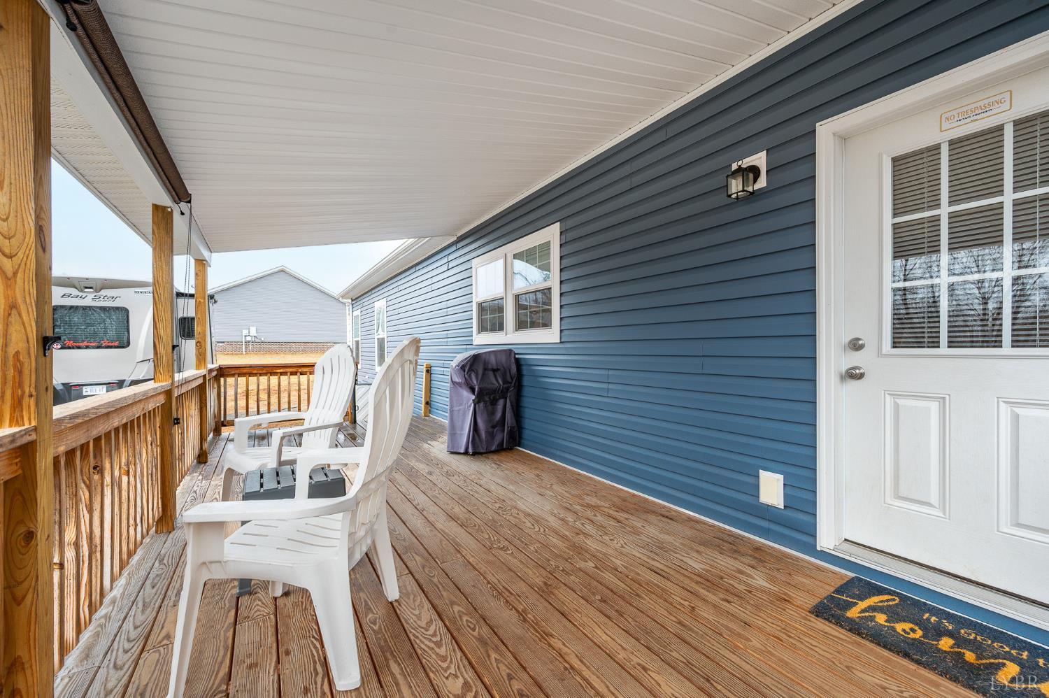 5049 Horseshoe Bend Road Goodview, VA 24095 - Photo 27 of 43 a view of a balcony with wooden floor and furniture