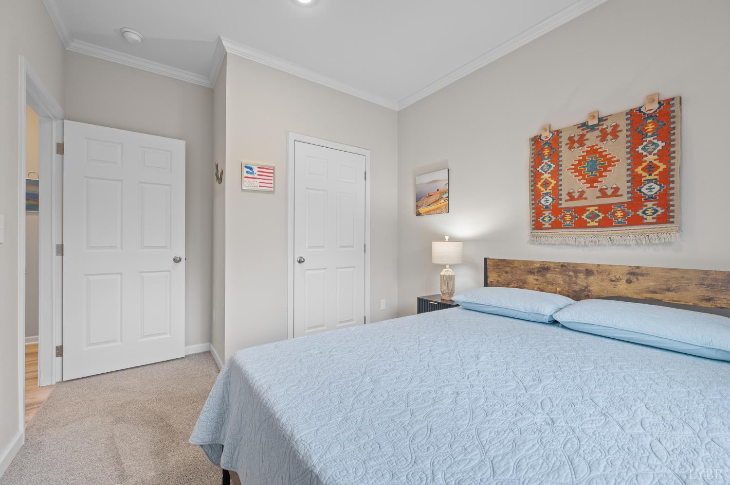 5049 Horseshoe Bend Road Goodview, VA 24095 - Photo 37 of 43 a bedroom with a bed and painting on the wall