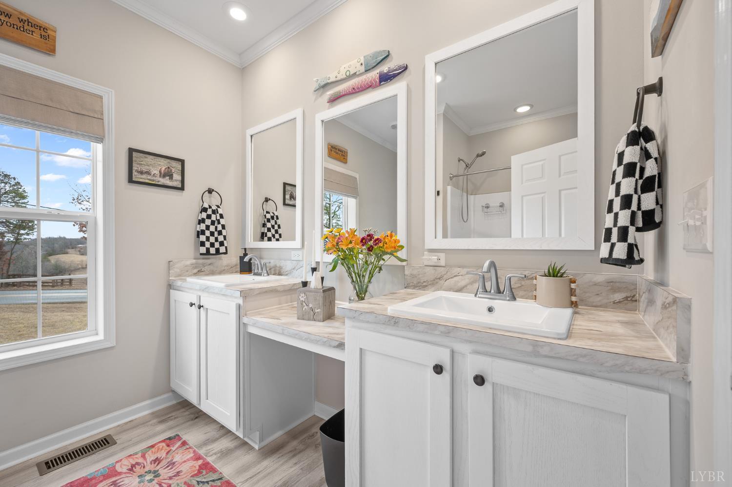 5049 Horseshoe Bend Road Goodview, VA 24095 - Photo 41 of 43 a bathroom with a sink double vanity and a mirror