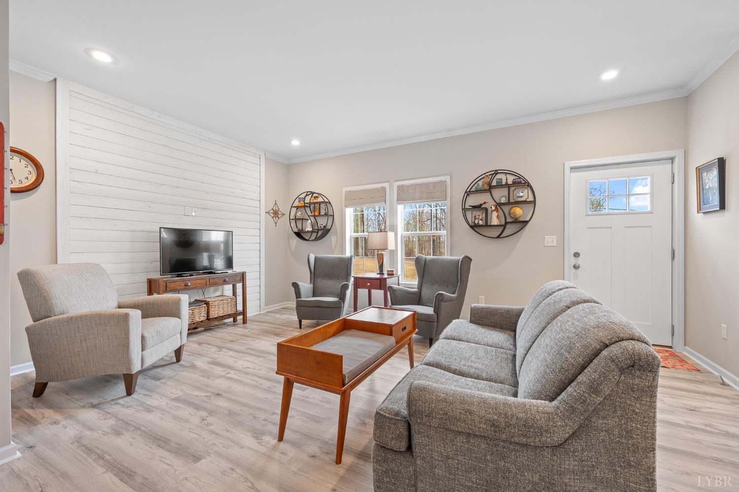 5049 Horseshoe Bend Road Goodview, VA 24095 - Photo 5 of 43 a living room with furniture and a flat screen tv