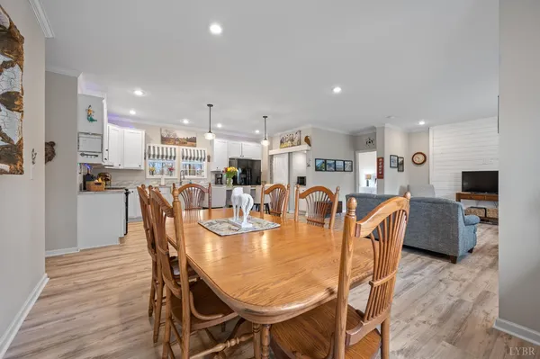 a kitchen with a sink refrigerator and cabinets