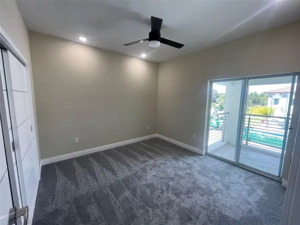 a spacious bathroom with a shower and sink