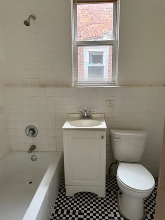 a bathroom with a sink toilet and bathtub