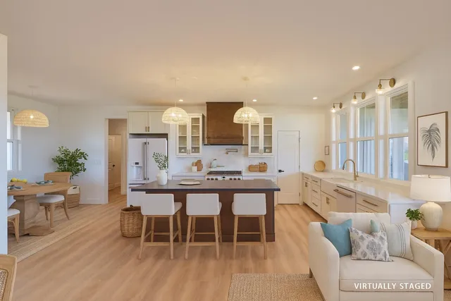 a large kitchen with a table and chairs