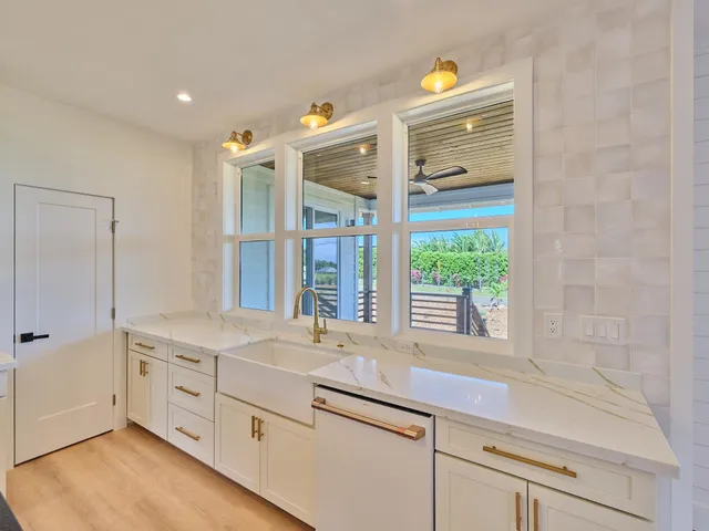 a bathroom with a sink and a large mirror
