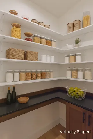 a spacious bedroom with a bed and a chandelier