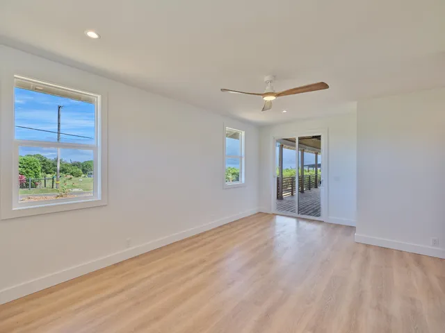a spacious bathroom with a double vanity sink and a mirror